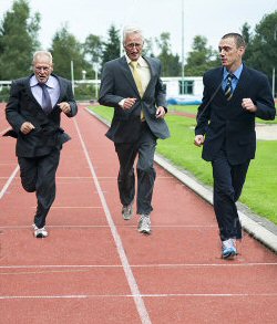 Businessmen running